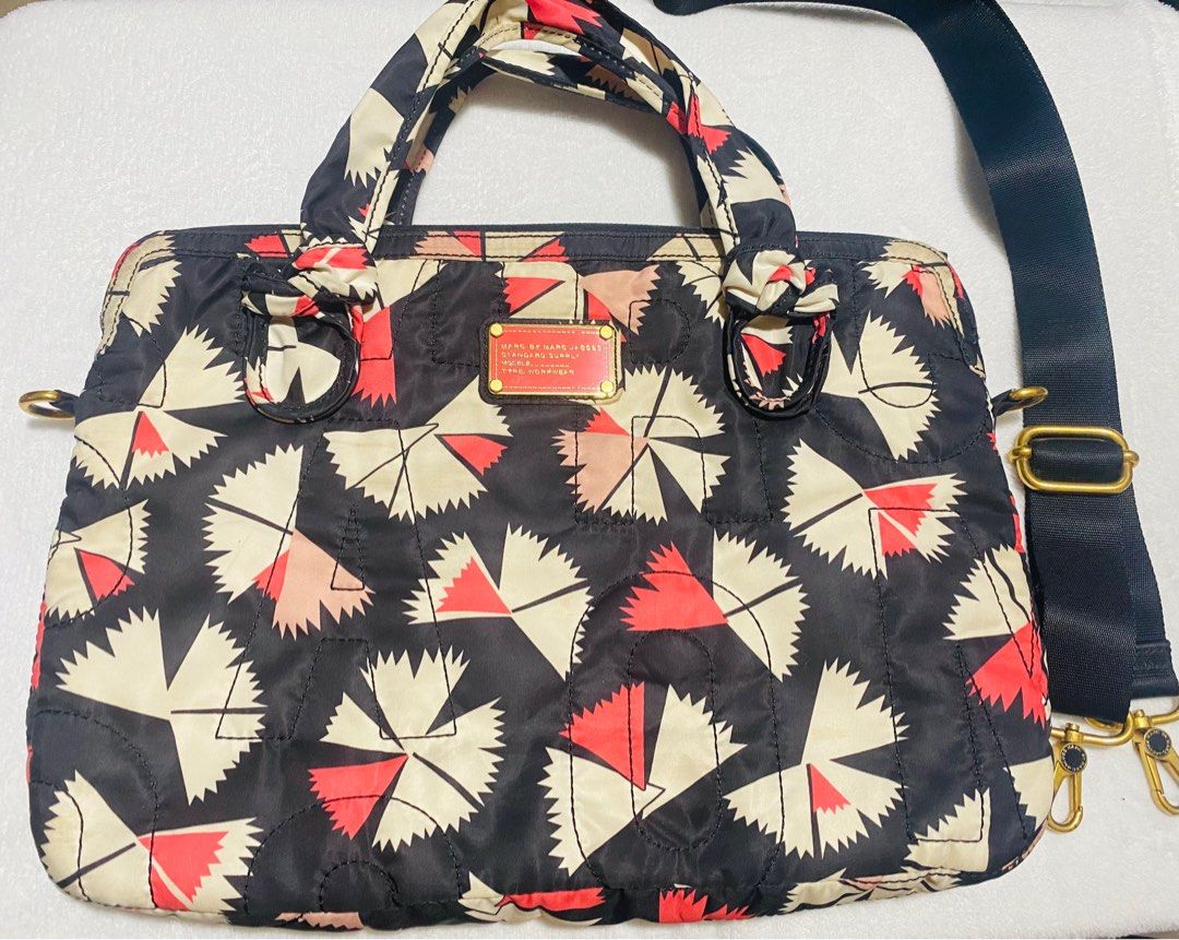 Marc Jacobs Laptop Bag with Sling (Category: Laptop Bags & Sleeves) located in Marikina City. Submitted by creatingmorespace (Listing ID 1361327023, Image 1). Description: Marc Jacobs Laptop Bag with Sling Size: 16”W x 11.3”H Sling looks like new Has yellow stains due to storage and usage but not very obvious due to design Given to me as a gift (not 100% sure if genuine) but still very nice and serves its purpose Very clean and soft inside (intac