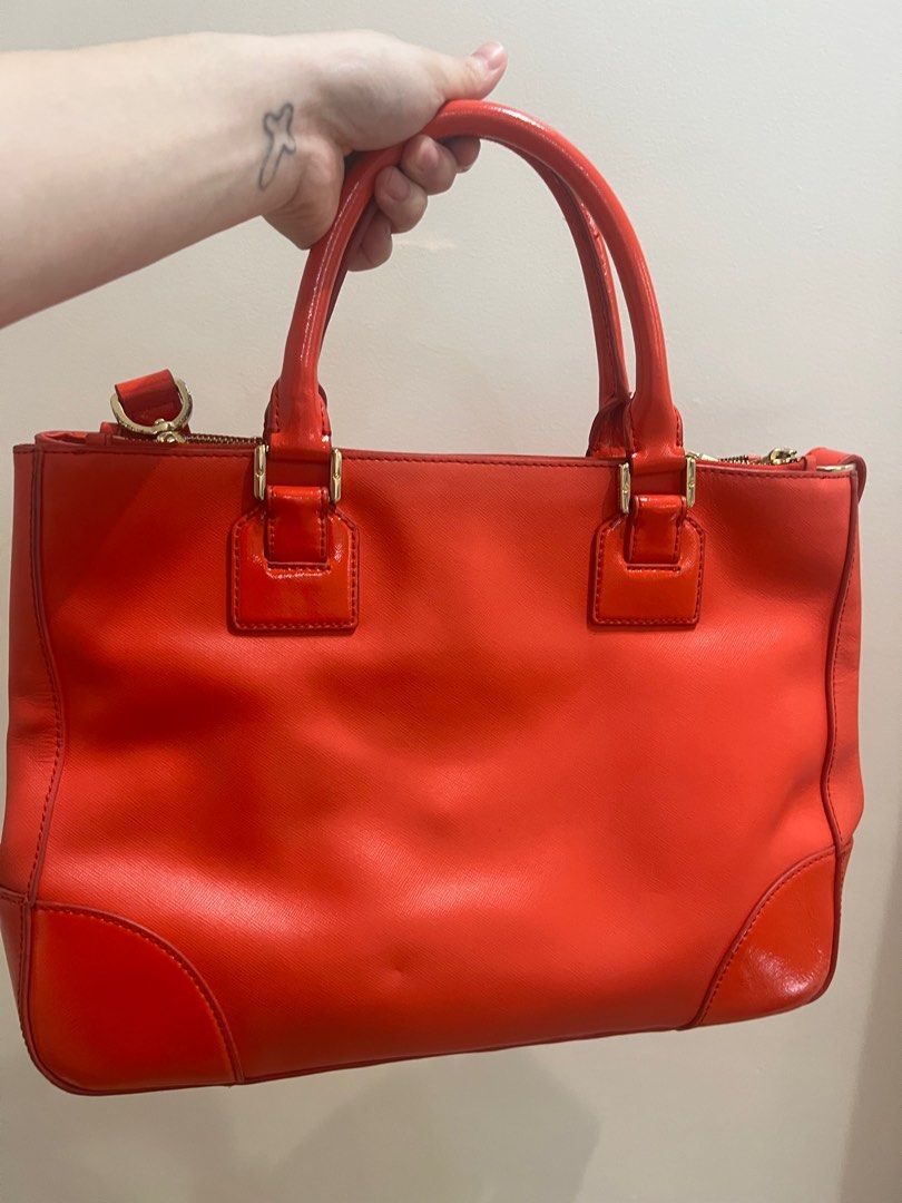 Tory Burch Red / Orange Bag (Category: Luxury Bags & Wallets) located in Bulacan. Submitted by roxanneio (Listing ID 1361303138, Image 3). Description: Authentic Tory Burch. Leather is in good condition. Wear and tear on the hardware. Message for more photos or video close up of the bag..