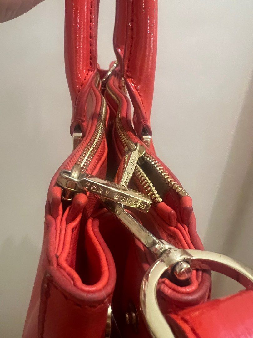 Tory Burch Red / Orange Bag (Category: Luxury Bags & Wallets) located in Bulacan. Submitted by roxanneio (Listing ID 1361303138, Image 2). Description: Authentic Tory Burch. Leather is in good condition. Wear and tear on the hardware. Message for more photos or video close up of the bag..