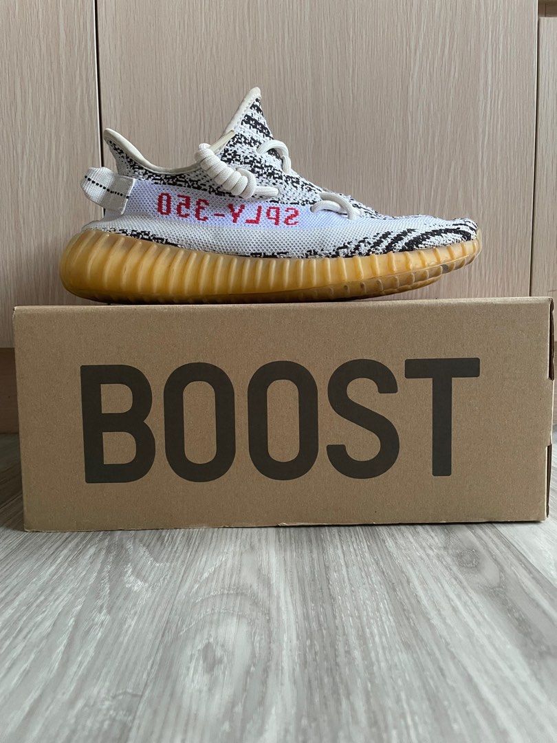(US7.5/UK7) Yeezy Boost 350 V2 Zebra (Category: Sneakers) located in Singapore. Submitted by clearingitems_ (Listing ID 1361216150, Image 1). Description: Selling as I’m no longer wearing it anymore. Had it for many years and the boost is very yellow as shown in pictures Overall condition of sneaker is as shown in pictures Text on the receipt has also almost faded due to time.