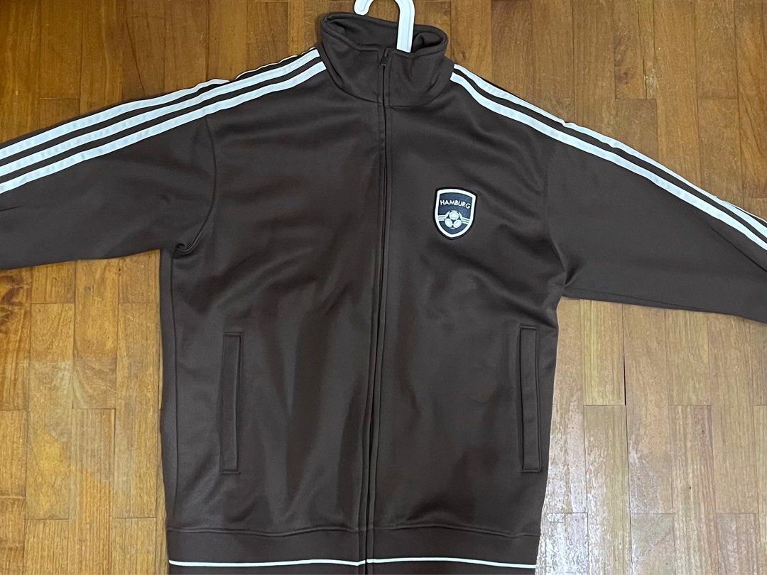 Vintage Adidas Jacket (Category: Coats, Jackets and Outerwear) located in Singapore. Submitted by julian_yeo_yy (Listing ID 1361201840, Image 2). Description: Authentic chocolate Adidas jacket for sale Condition 9.5/10, only slight yellowing on the tag, basically new condition especially considering the age. Letting go as sadly too small for me.