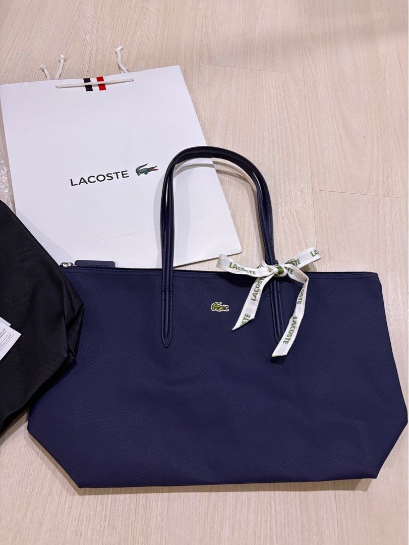 Authentic Lacoste tote bag (Category: Tote Bags) located in Del Monte. Submitted by summer_1988 (Listing ID 1346479177, Image 1). Description: Brand new🐊Lacoste tote bag Made in France 🇫🇷 Inclusions: ✅Original tags and packaging ✈️Same day delivery within Metro Manila ✈️2 day shipping for Provincial 📍My location: Quezon City roosevelt 💠Available in navy blue and black .