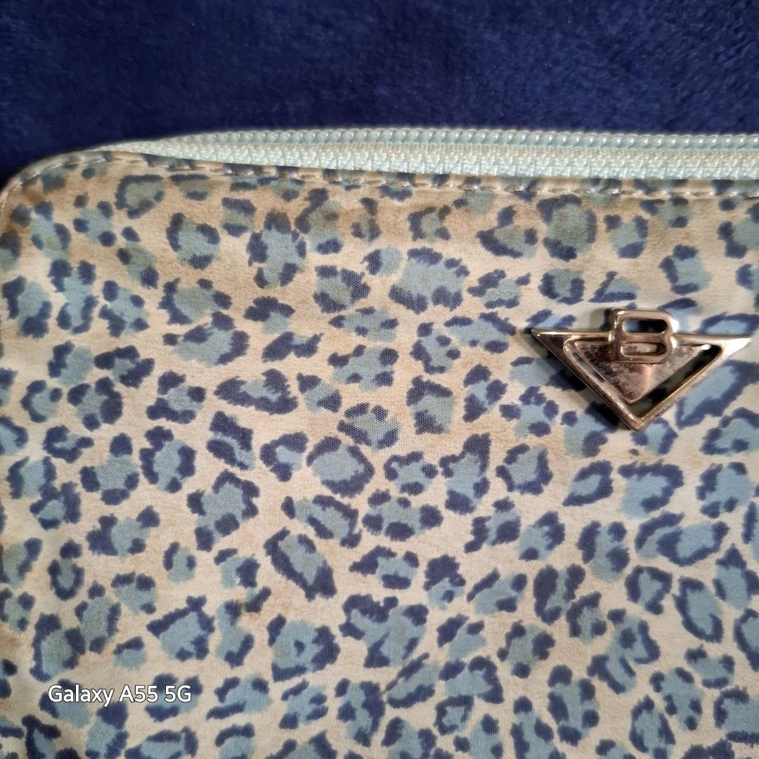 Bottega Veneta zippy wallet (Category: Luxury Bags & Wallets) located in Don Carlos. Submitted by PphiXi_Finds (Listing ID 1356393551, Image 2). Description: Authentic vintage leopard design zippy wallet. The only issue is that it needs cleaning. leather and cloth material. MOP: Gcash Courier: Flash Express *** NO RUSH SHIPPING PLEASE.