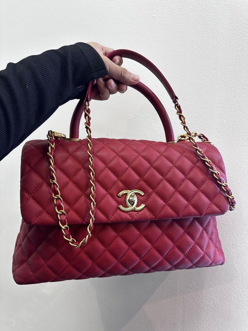CHANEL Coco Medium Red Caviar Top Handle Bag (Category: Luxury Bags & Wallets) located in Taguig. Submitted by mluxeph (Listing ID 1356250204, Image 2). Description: CHANEL Coco Medium Red Caviar Top Handle Bag Year: 2018 with Removable strap and authenticity card from Chanel.