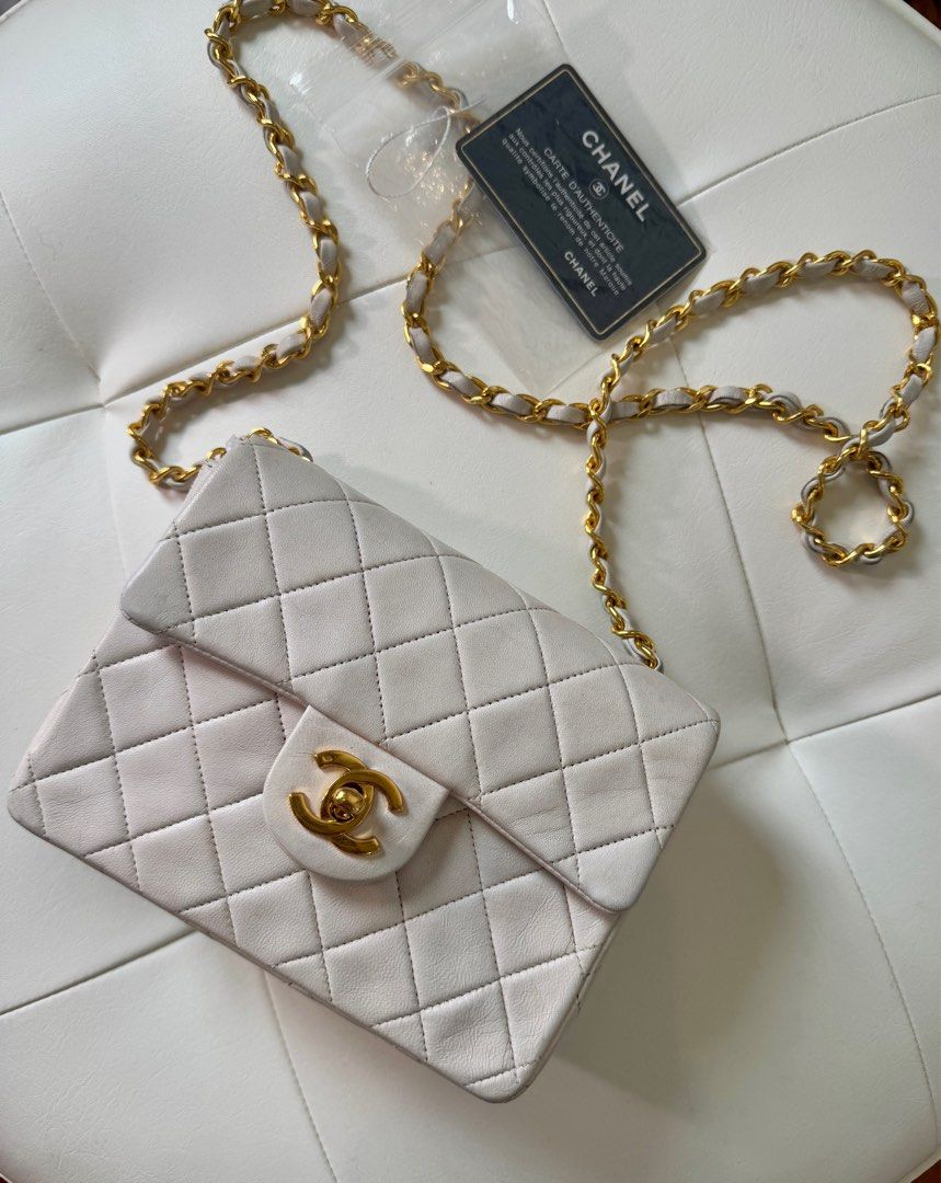 Chanel Mini Square (Category: Luxury Bags & Wallets) located in San Juan City. Submitted by urbanvintagesquad (Listing ID 1356430497, Image 1). Description: 1989-1991 Mini Square Classic Lambskin Single Flap crossbody bag Comes with authenticity card, box and dustbag quilted lambskin leather body leather woven chain link shoulder strap front flap with turn-lock closure exterior back slip pocket interior zip and slip pockets White. Serial Number: 