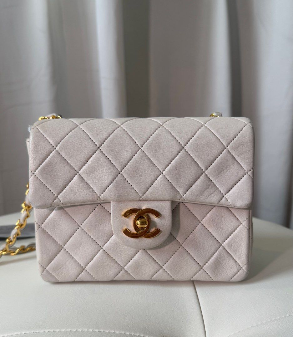 Chanel Mini Square (Category: Luxury Bags & Wallets) located in San Juan City. Submitted by urbanvintagesquad (Listing ID 1356430497, Image 2). Description: 1989-1991 Mini Square Classic Lambskin Single Flap crossbody bag Comes with authenticity card, box and dustbag quilted lambskin leather body leather woven chain link shoulder strap front flap with turn-lock closure exterior back slip pocket interior zip and slip pockets White. Serial Number: 