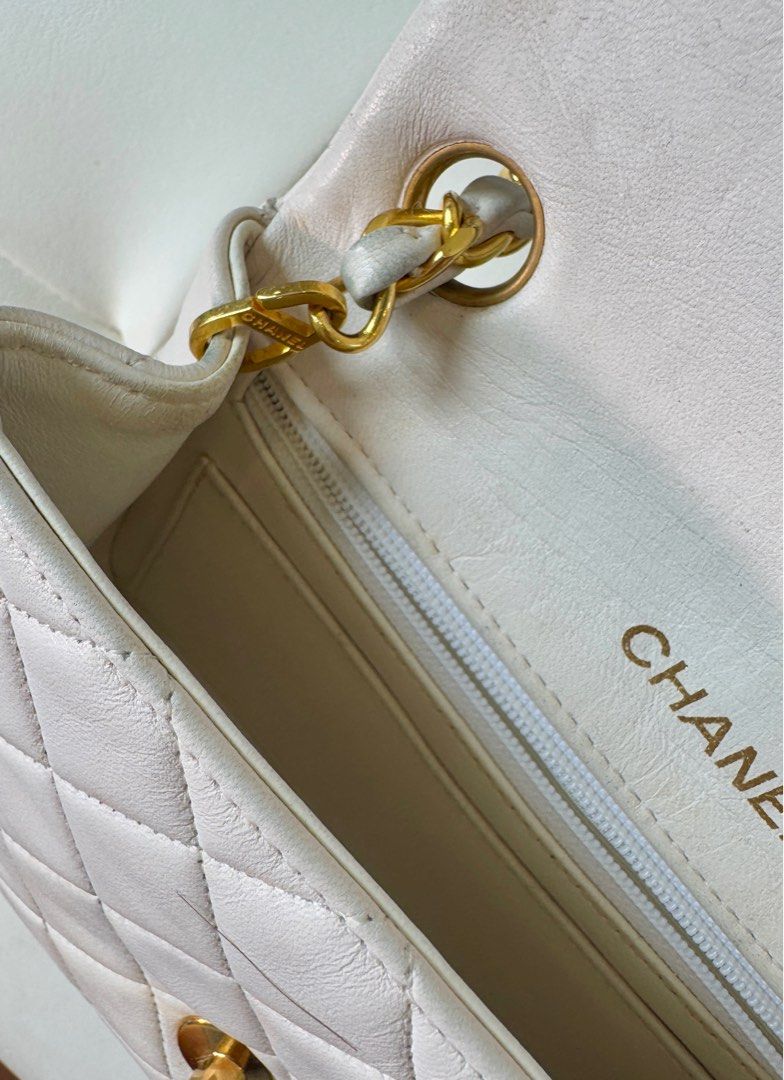 Chanel Mini Square (Category: Luxury Bags & Wallets) located in San Juan City. Submitted by urbanvintagesquad (Listing ID 1356430497, Image 3). Description: 1989-1991 Mini Square Classic Lambskin Single Flap crossbody bag Comes with authenticity card, box and dustbag quilted lambskin leather body leather woven chain link shoulder strap front flap with turn-lock closure exterior back slip pocket interior zip and slip pockets White. Serial Number: 