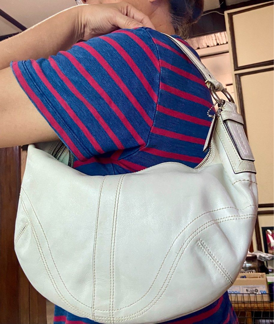 Coach White Leather Hobo Bag (Category: Luxury Bags & Wallets) located in Manila. Submitted by rosamanerds (Listing ID 1356289006, Image 3). Description: Authentic preloved Coach white leather bag in very good condition. No issue or flaw. In silver hardware.