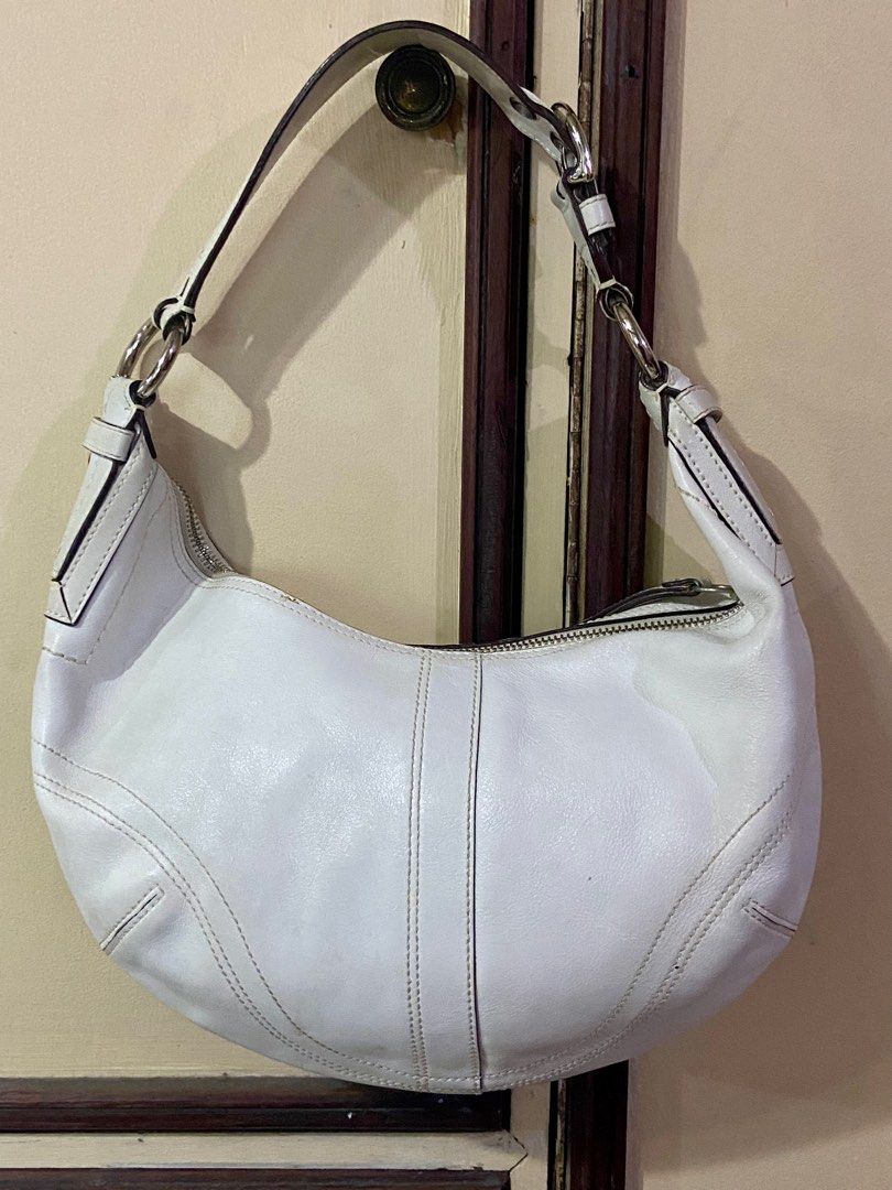 Coach White Leather Hobo Bag (Category: Luxury Bags & Wallets) located in Manila. Submitted by rosamanerds (Listing ID 1356289006, Image 2). Description: Authentic preloved Coach white leather bag in very good condition. No issue or flaw. In silver hardware.