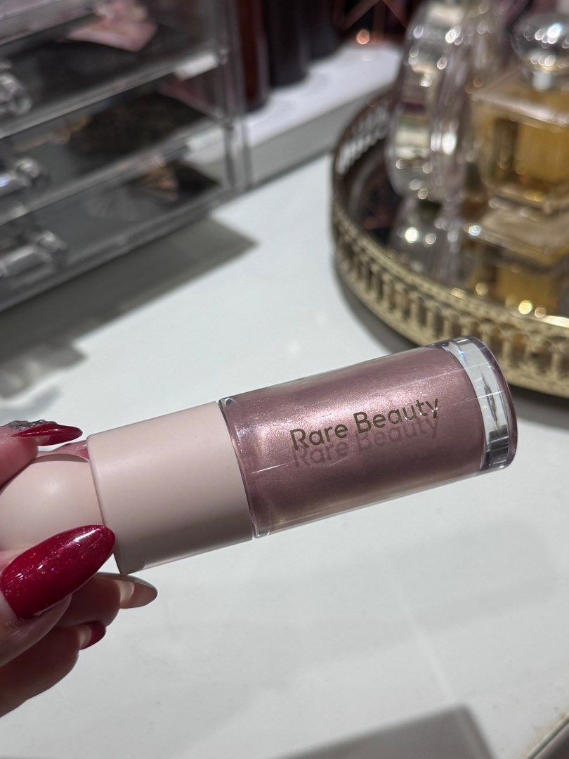 Rare Beauty Liquid Luminizer in Enchant (Category: Makeup) located in Quezon City. Submitted by closetsforgoddess (Listing ID 1356294880, Image 2). Description: Like new. Just tried it once. Really pretty if you’re into luminizer. Bought from Sephora 🩷 Full sized blush.