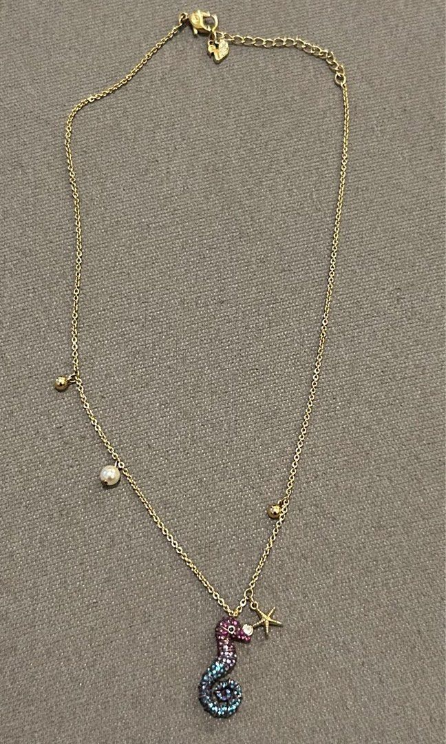 Swarovski Multi-colored Seahourse necklace (Category: Necklaces) located in Quezon City. Submitted by bea30 (Listing ID 1356335199, Image 3). Description: Ocean Seahorse Pendant, Multi-colored, Gold-tone plated With starfish charm 38cm Comes with original box and paperbag Rfs: decluttering.