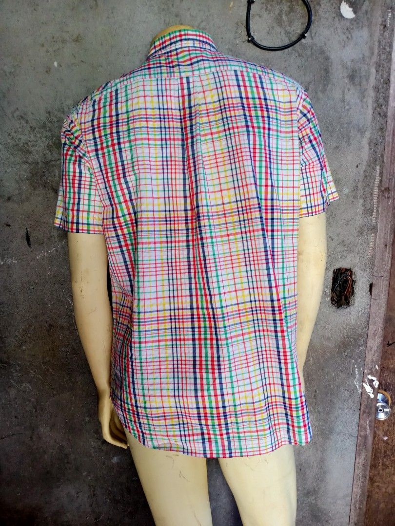 Uniqlo Polo Checkered for Men (Category: Tshirts & Polo Shirts ) located in Taguig. Submitted by Wacofancy (Listing ID 1354886616, Image 2). Description: Good as new Color may vary due to light. Size on tag: XL Actual Size: Width 22 inch armpit to armpit. Length 32 inch from shoulder to bottom..