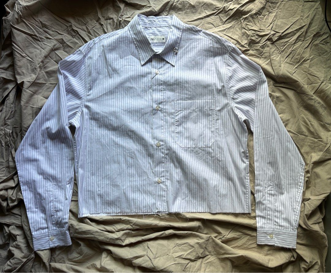 ZARA Button-down Long-sleeve Crop Shirt with Piercing (Category: Tshirts & Polo Shirts ) located in Mandaluyong City. Submitted by offlegitstore (Listing ID 1356314745, Image 1). Description: .