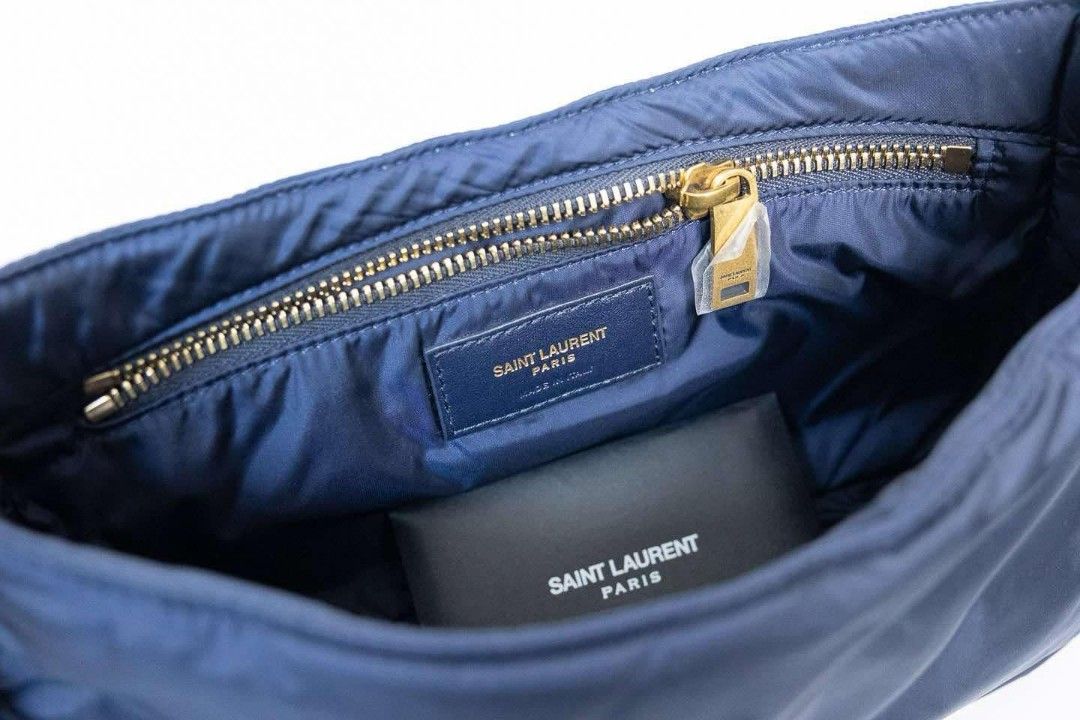 Auth YSL Nylon Bag Gold Hardware Shoulder Bag (Category: Luxury Bags & Wallets) located in Quezon City. Submitted by miyandabear (Listing ID 1356450682, Image 3). Description: guaranteed authentic 2x money back if proven fake original price at 170k+ bought in Shangrila Yves Saint Laurent Navy Blue nylon and red leather trim with gold hardware Includes: Booklet, authenticity card, dust bag Measurements: 9.5" L x 2.15" W x 6" H Interior Pockets: On