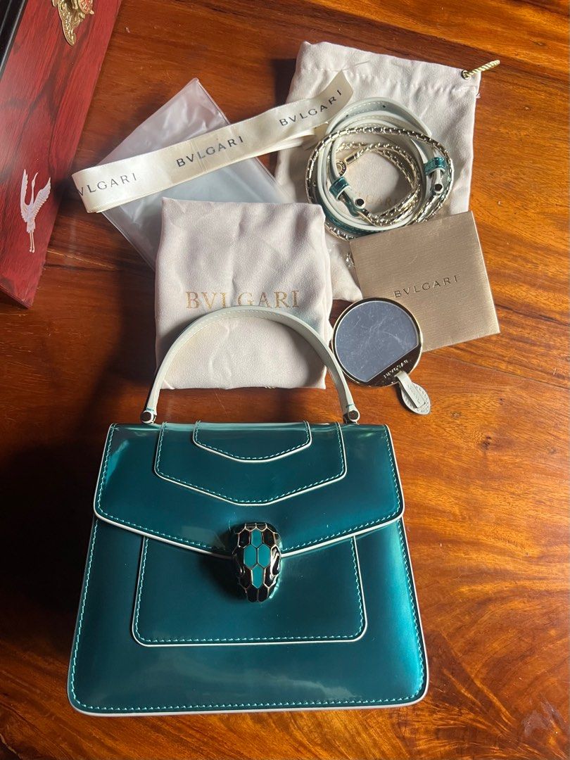 Bvlgari serpenti top handle (Category: Luxury Bags & Wallets) located in Baguio. Submitted by Passionista_2600 (Listing ID 1356515595, Image 1). Description: From japan box Comes with intl authenticity card, dustbags, mirror, raincoat and ribbon With serial code and holo Medium top handle .