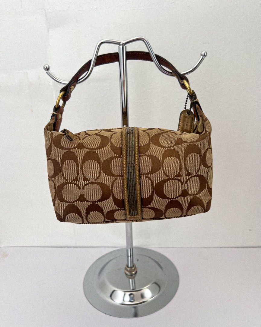 Vintage/ Y2K Coach Bag (Category: Luxury Bags & Wallets) located in Taguig. Submitted by andarieph (Listing ID 1356475698, Image 1). Description: Coach Signature Monogram Canvas Small Beaded Bag ₱1,500 100% Authentic Rank C: Heavily used items with obvious wear and tear in the form of scratches and/or marks. Note: Dirty canvas. Suede piping near the zipper shows noticeable wear, with fraying and peeling. Pen marks inside the lining. Removability 