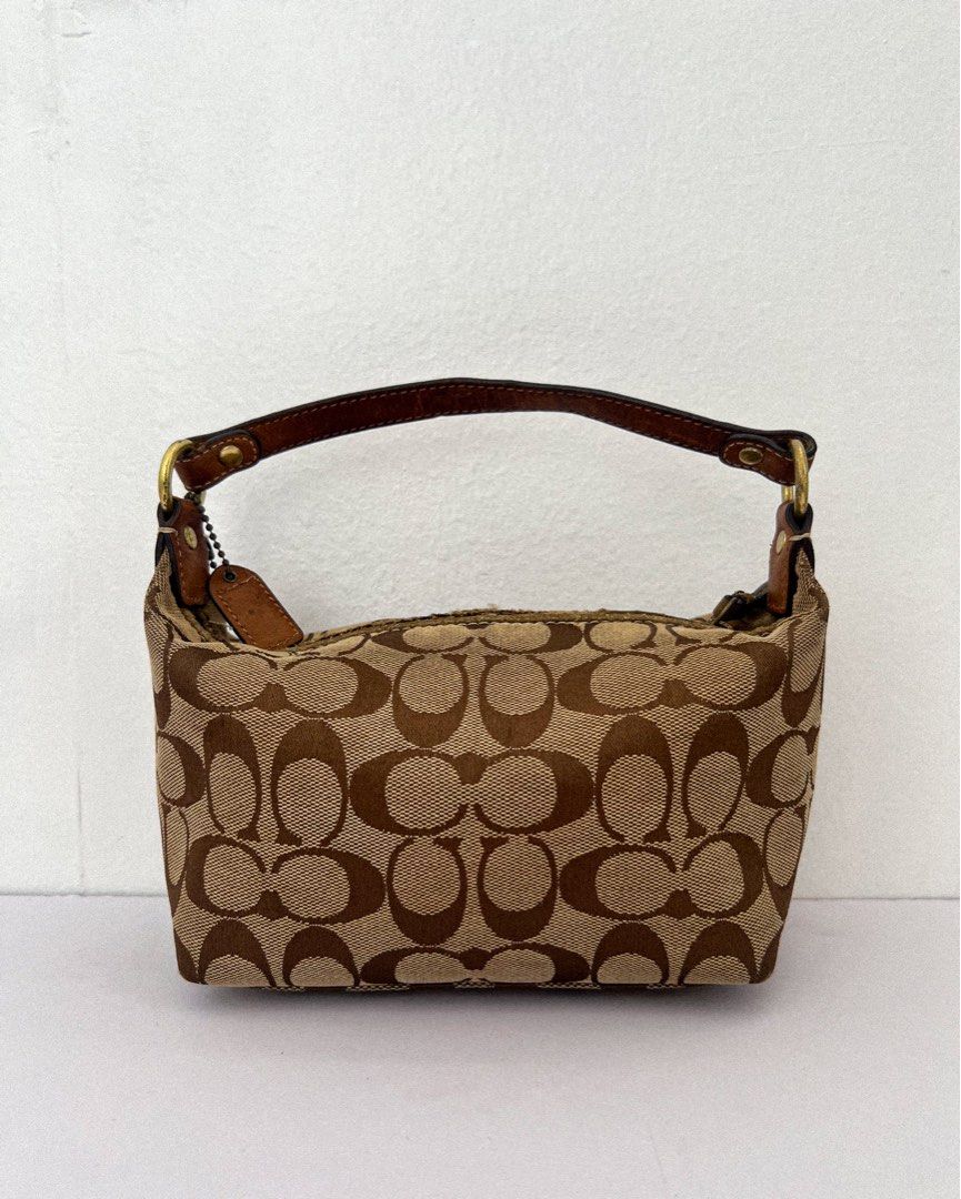Vintage/ Y2K Coach Bag (Category: Luxury Bags & Wallets) located in Taguig. Submitted by andarieph (Listing ID 1356475698, Image 3). Description: Coach Signature Monogram Canvas Small Beaded Bag ₱1,500 100% Authentic Rank C: Heavily used items with obvious wear and tear in the form of scratches and/or marks. Note: Dirty canvas. Suede piping near the zipper shows noticeable wear, with fraying and peeling. Pen marks inside the lining. Removability 