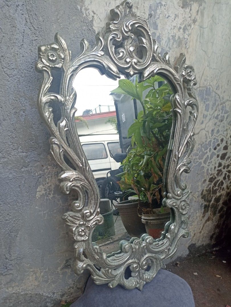 Wall Mirror Baroque Art Style (Category: Mirrors) located in Marikina City. Submitted by jrssags (Listing ID 1356517899, Image 1). Description: Wall Mirror – Baroque Art Style (Silver Finish) Dimensions: 63 cm (Length) x 40 cm (Width) Color: Silver Material: Mixed metal (Most parts are non-magnetic, edges are slightly magnetic) Origin: From my grandmother’s house Location: Barangay Concepcion Uno, Marikina City Shipping: Buyer shoulders the shipp