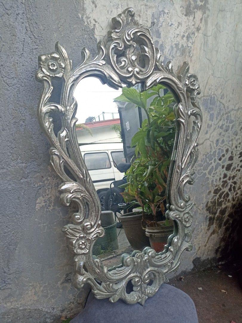 Wall Mirror Baroque Art Style (Category: Mirrors) located in Marikina City. Submitted by jrssags (Listing ID 1356517899, Image 2). Description: Wall Mirror – Baroque Art Style (Silver Finish) Dimensions: 63 cm (Length) x 40 cm (Width) Color: Silver Material: Mixed metal (Most parts are non-magnetic, edges are slightly magnetic) Origin: From my grandmother’s house Location: Barangay Concepcion Uno, Marikina City Shipping: Buyer shoulders the shipp