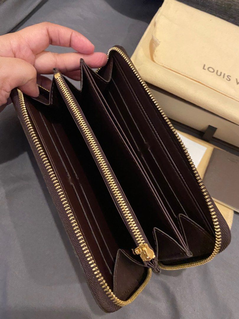 Authentic Louis Vuitton Vernis zippy wallet in Amarante (like new) (Category: Luxury Bags & Wallets) located in Batangas. Submitted by itsmeaudi (Listing ID 1356702321, Image 2). Description: - Like new! No flaws - Used only twice - Authentic Louis Vuitton 💯 - Store bought at LV greenbelt ( with scanned copy of receipt) - Date Code: CA1018 - manufactured March 2008 - inclusion: box, dustbag, care cards, lv cloth wipes for vernis leather RFS: not