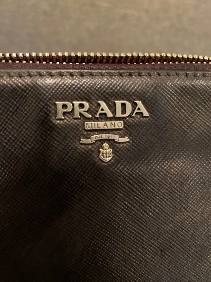 Authentic Prada Wallet (Category: Luxury Bags & Wallets) located in Batangas. Submitted by itsmeaudi (Listing ID 1356706265, Image 3). Description: - Selling my preloved Original Prada wallet💯 - flaws: Black recoloring of some parts has faded over time due to prolonged storage (originally pink)- refer to picture #9-10 - selling low due to signs of usage.