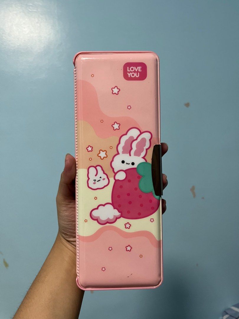 Pink Bunny Pencil Case (Category: Everything Else Others) located in Paranaque City. Submitted by calicoe (Listing ID 1356769726, Image 2). Description: 𓂃⋆.⟢ ♱ ⟢ .⋆𓂃 ♯┆ fs : pink bunny pencil case ˶ᵔ ᵕ ᵔ˶ ! condition : 9/10 flaws : no provided schedule in the front case, pencil markings in each side — loc : moonwalk, parañaque city — mop : gcash only — mod : lalamove / jnt / lbc ⛓️‍💥⟢ shipping dates are every tues & fri-sun, but seller’s avail