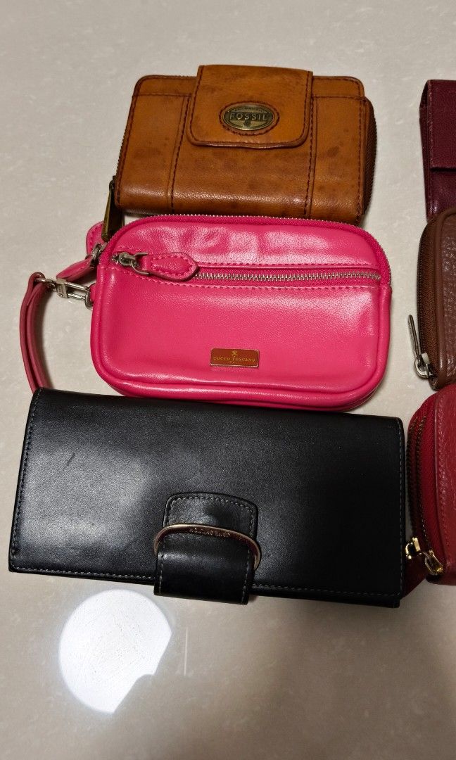 Preloved wallets (Category: Purses & Pouches) located in Singapore. Submitted by dio_solo (Listing ID 1356731949, Image 2). Description: Various wallets up for grab. Helping a senior to sell these precious wallets. Not for fussies. $100 quick deal if you buy all. Brands include: Jane Shelton London Tocco Toscano Italy GUESS USA Fossil.