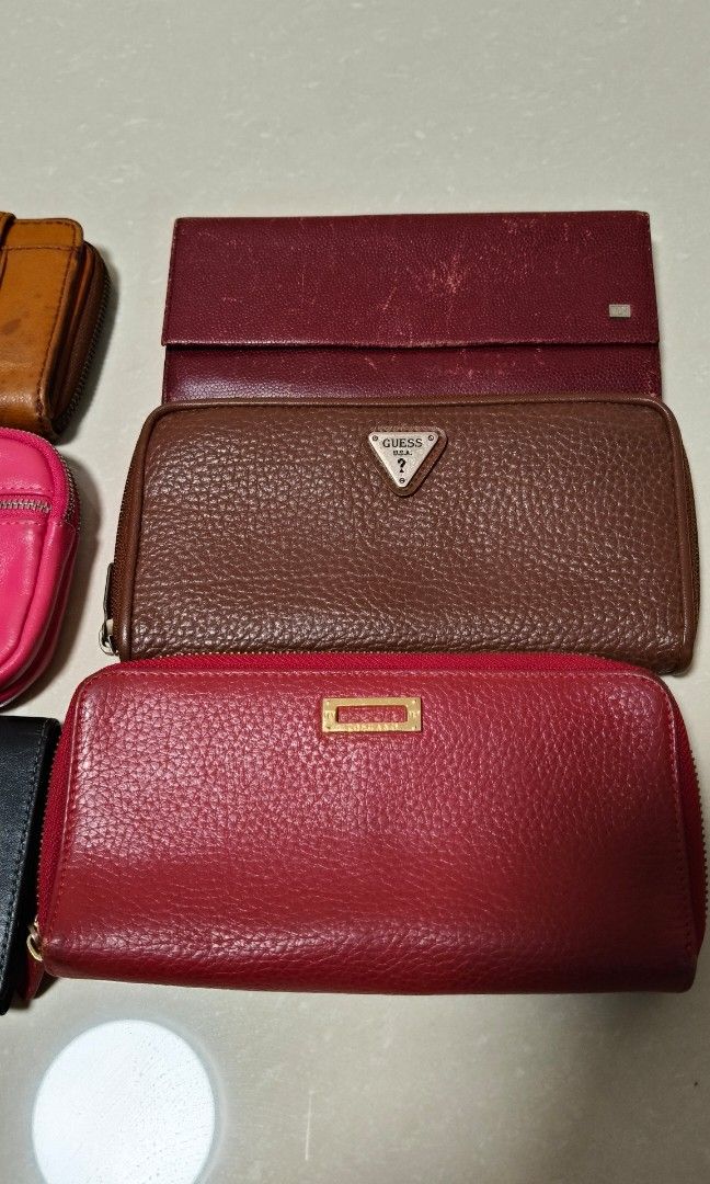 Preloved wallets (Category: Purses & Pouches) located in Singapore. Submitted by dio_solo (Listing ID 1356731949, Image 3). Description: Various wallets up for grab. Helping a senior to sell these precious wallets. Not for fussies. $100 quick deal if you buy all. Brands include: Jane Shelton London Tocco Toscano Italy GUESS USA Fossil.
