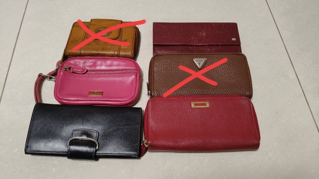 Preloved wallets (Category: Purses & Pouches) located in Singapore. Submitted by dio_solo (Listing ID 1356731949, Image 1). Description: Various wallets up for grab. Helping a senior to sell these precious wallets. Not for fussies. $100 quick deal if you buy all. Brands include: Jane Shelton London Tocco Toscano Italy GUESS USA Fossil.