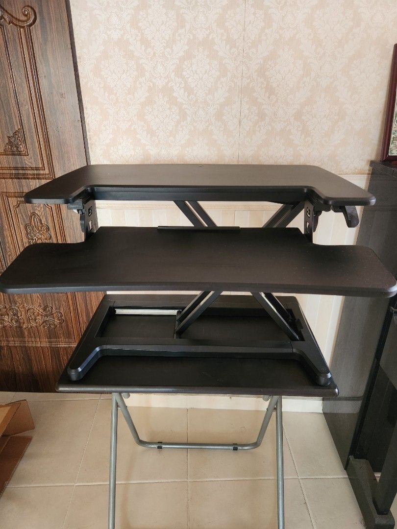 Computer Table (Category: Other Home Furniture) located in Singapore. Submitted by blissout (Listing ID 1356878716, Image 1). Description: Ergoedge desk riser for sitting and standing. 76cm x 60cm to sit on a desk with smooth hydraulics extension to max of 50cm height. Removeable keyboard tray. 14.7kg - requires transportation #workfromhome #workstanding #work #ergonomics.