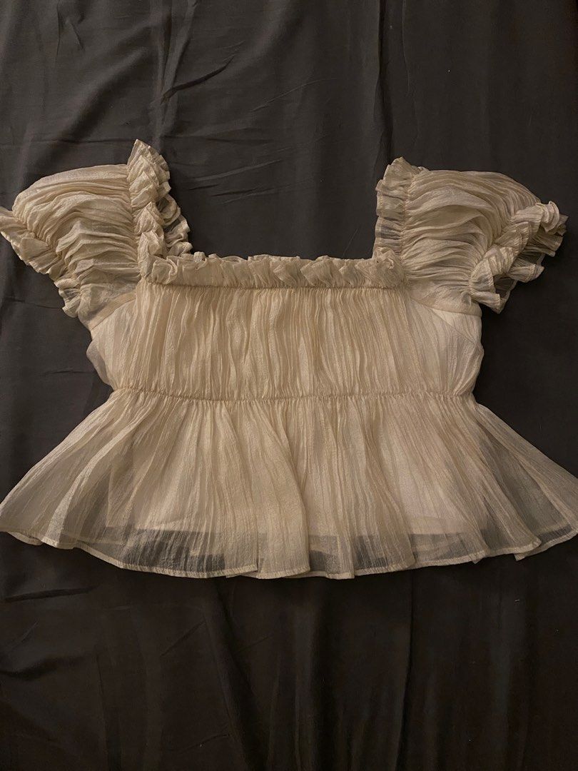 Cream Off Shoulder Peplum Top w/ Ruffles (Category: Blouses) located in Rizal. Submitted by TheRetailAddict (Listing ID 1356940387, Image 1). Description: - Lightweight - May fit sizes medium to large - Not true to size - Color may vary due to lighting.