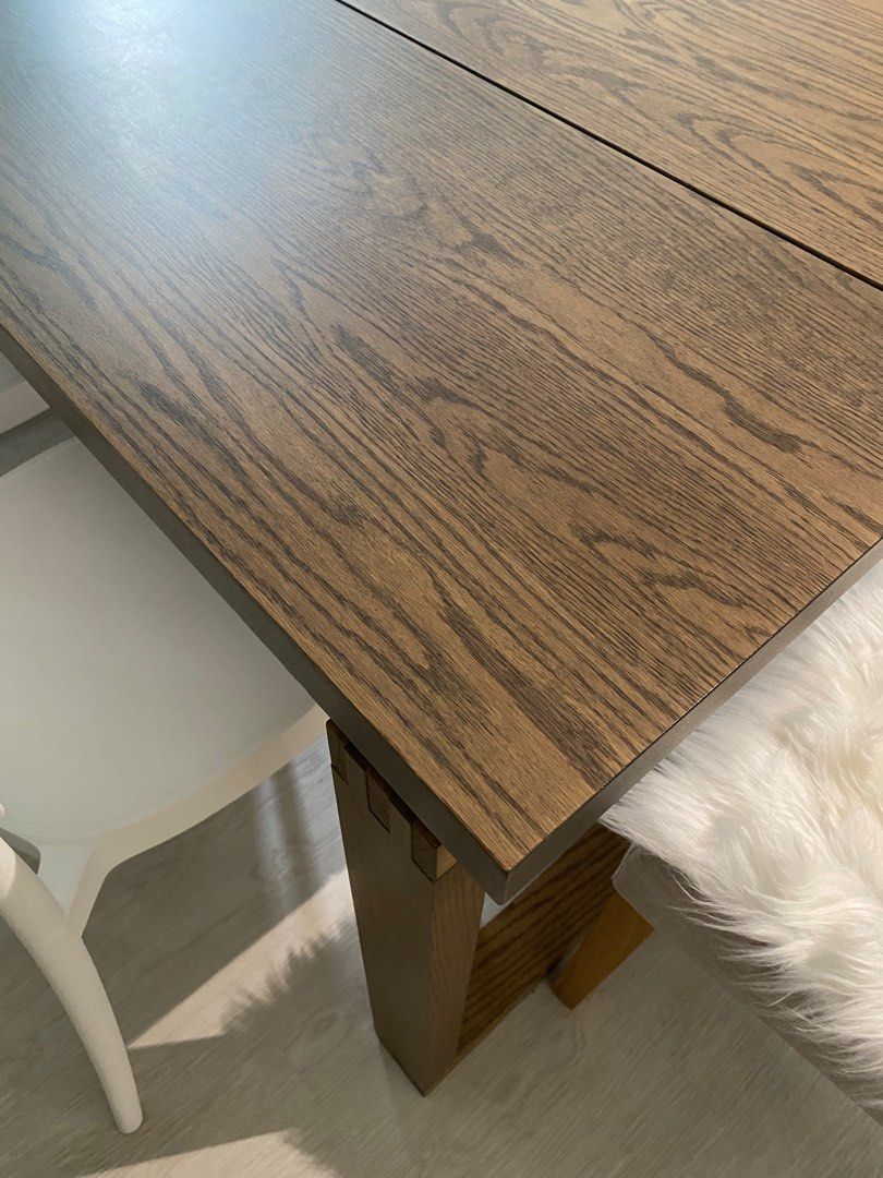 Dining table (Category: Tables & Sets) located in Singapore. Submitted by dmajor7 (Listing ID 1356851060, Image 2). Description: Almost perfect condition! Only tiny scratches on one of the legs. **Only use for 1 year (all halal foods only). Bought at $799 from Ikea. Selling for only $430 Quality: Heavy, very sturdy Measurements: Length: 140 cm Width: 85 cm Height: 75 cm Colour: Oak veneer brown stained.