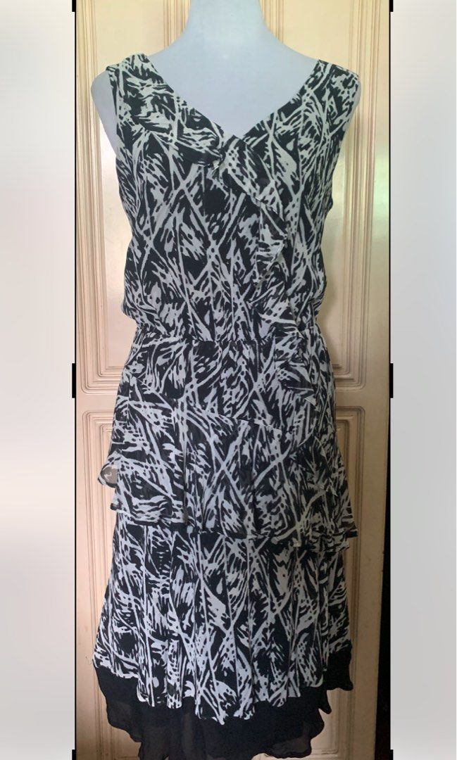 Kenneth Cole B/W Dress (Category: Dresses) located in Quezon City. Submitted by FashionSense4Less (Listing ID 1356835855, Image 1). Description: Kenneth Cole Black and White Ruffle Dress Very good condition/ like new Slip on/ no pocket / with lining/ garterized waist Size : 6 on tag (medium) but fits xlarge Bust: 40-42” ; Waist: 28-42” ; Length: 42” Very nice in actual .