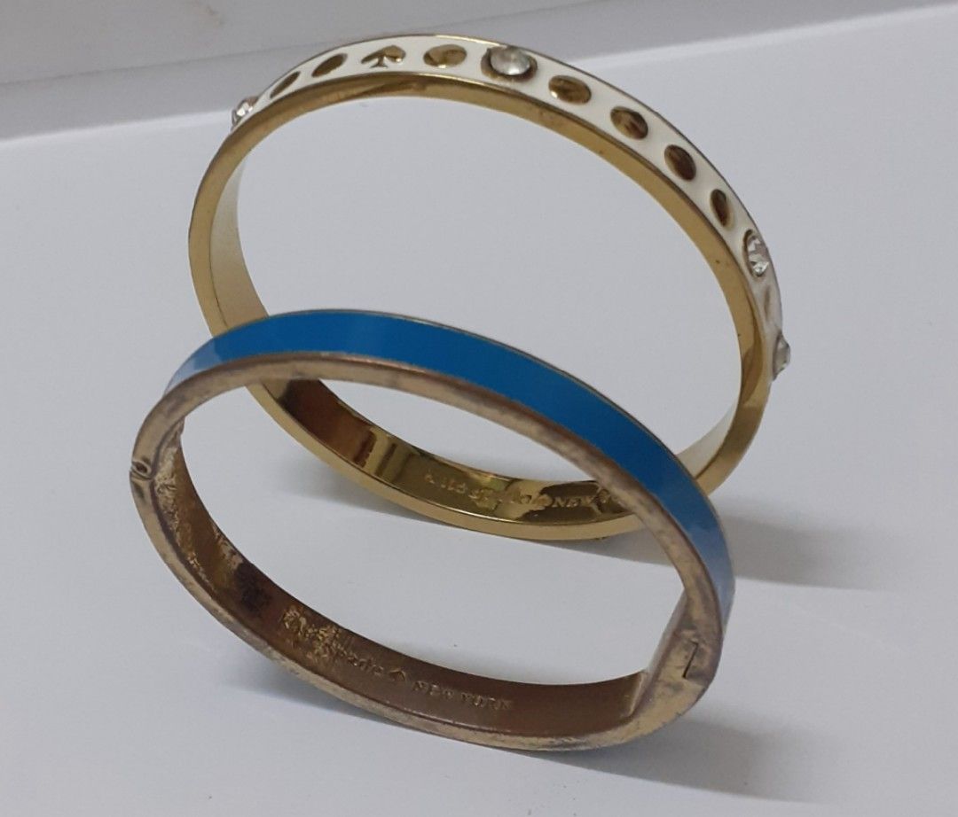 Authentic KATE SPADE BANGLE BRACELET BUNDLE (Category: Bracelets) located in Manila. Submitted by eriiicaspage (Listing ID 1357116965, Image 2). Description: PreOwned ^Lightly Used Authentic 💯💯 Kate Spade bangle bracelet bangle Stainless Slteel 💙Light blue .head in the Cloud & K♠️S logo .nakaEngraved sa hardware Authentic 💯 Sign of Used Condition . flaws ,tarnished hardware needs to clean 🤍White wth Stones .Authentic 💯,LikeNew in Condition 