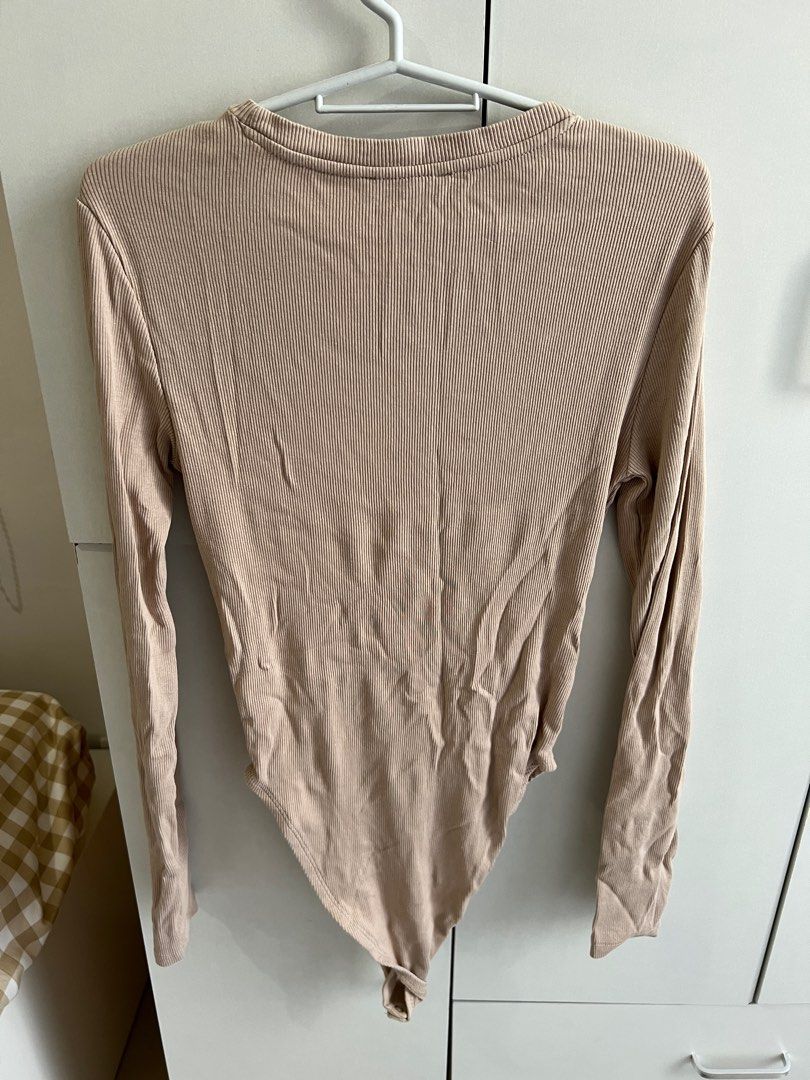 Brown longsleeves bodysuit (Category: Longsleeves) located in Bulacan. Submitted by lezzdeclutter (Listing ID 1357091527, Image 2). Description: Can fit Medium to Large Personal fave ✨💯 NO Flaws Rfs: decluttering since i’m now pregnant 📍Malolos, Bulacan.