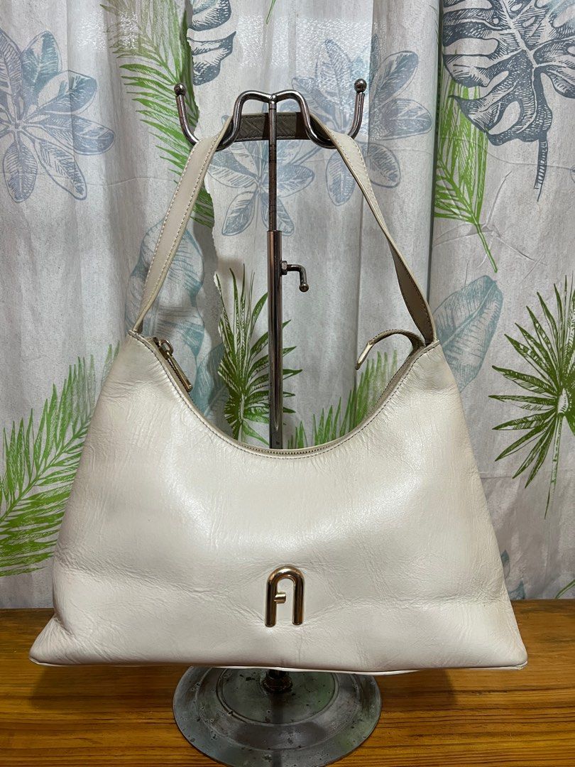 Furla White Shoulder bag (Category: Luxury Bags & Wallets) located in Baguio. Submitted by blossombeauty.chicfinds23 (Listing ID 1357081401, Image 1). Description: VGC 13”w, 9”h, 3”b authentic plus shippingfee thru j&t or JRS No Cop/Cod .