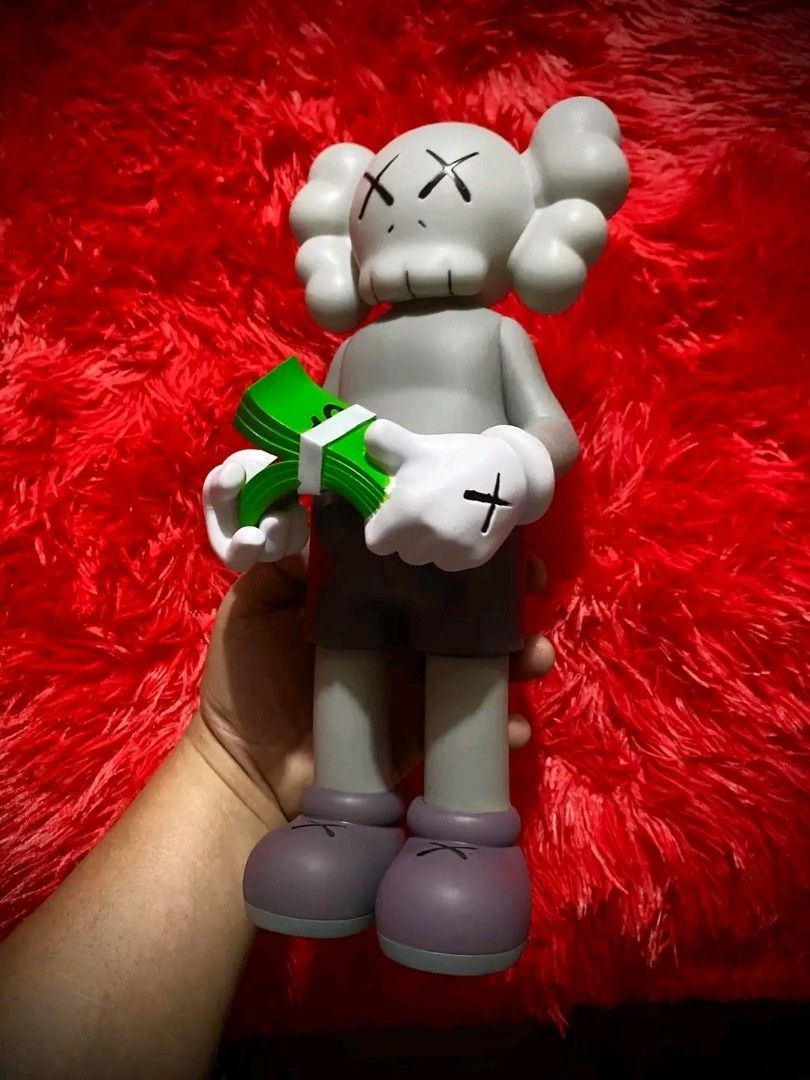 KAWS Cash (Category: Figurines & Statues) located in Pasig City. Submitted by akindzshop2 (Listing ID 1357045466, Image 2). Description: KAWS Cash 2500 EACH Almost 13 inches tall Vinyl Materials With Original box With Clamshell With Markings: Kaws Medicom Toy Valley 1 Parañaque Pick up Lalamove Flash express shipping Lbc shipping.