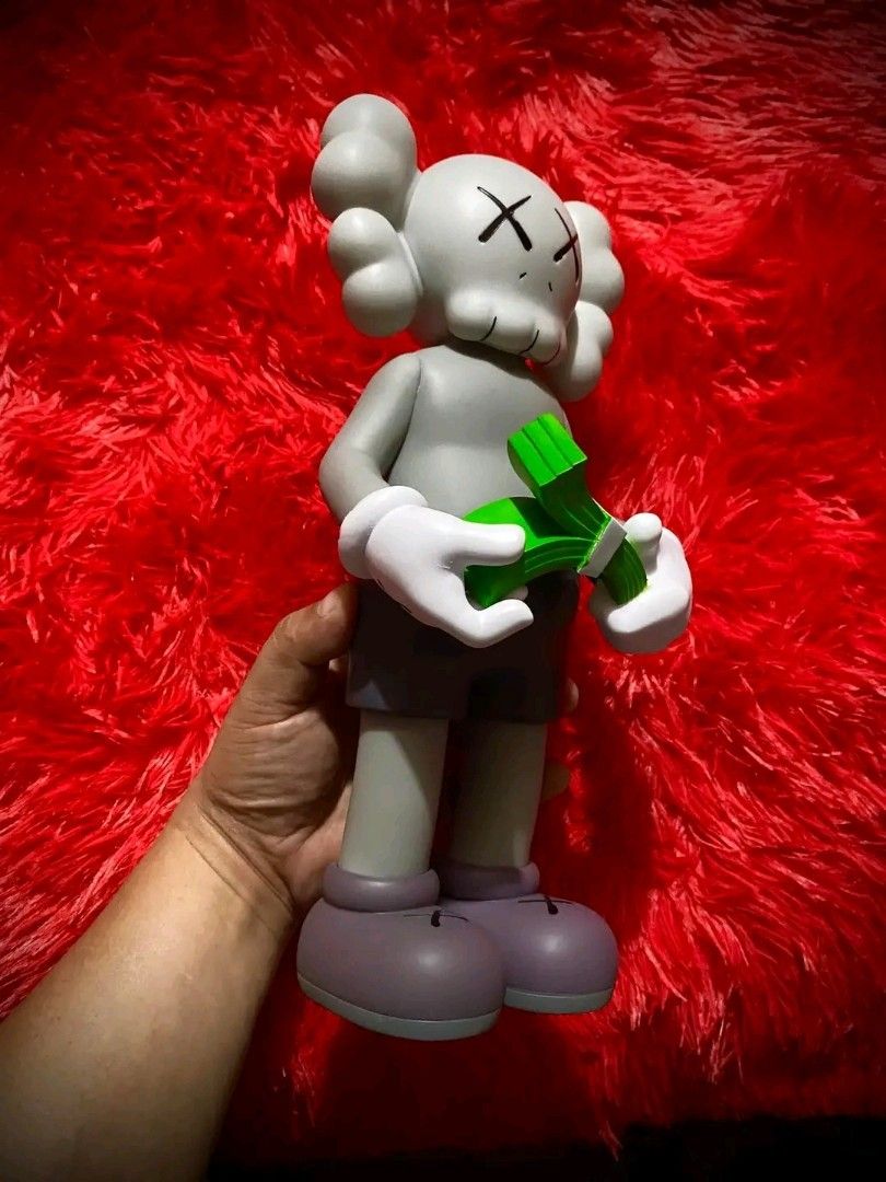 KAWS Cash (Category: Figurines & Statues) located in Pasig City. Submitted by akindzshop2 (Listing ID 1357045466, Image 3). Description: KAWS Cash 2500 EACH Almost 13 inches tall Vinyl Materials With Original box With Clamshell With Markings: Kaws Medicom Toy Valley 1 Parañaque Pick up Lalamove Flash express shipping Lbc shipping.