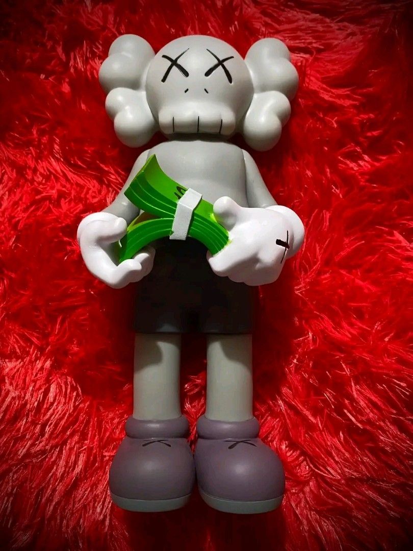 KAWS Cash (Category: Figurines & Statues) located in Pasig City. Submitted by akindzshop2 (Listing ID 1357045466, Image 1). Description: KAWS Cash 2500 EACH Almost 13 inches tall Vinyl Materials With Original box With Clamshell With Markings: Kaws Medicom Toy Valley 1 Parañaque Pick up Lalamove Flash express shipping Lbc shipping.