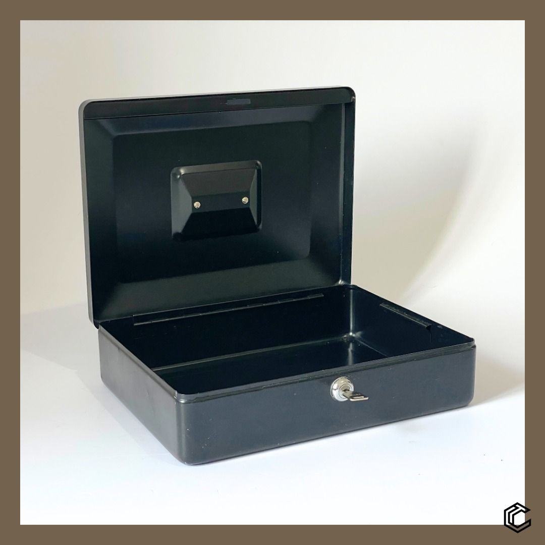 SentrySafe Locking Cash Box – Model CB-12 (Category: Safe) located in Bacoor. Submitted by box_of_randoms (Listing ID 1357121159, Image 2). Description: Specifications: • Brand: SentrySafe • Model: CB-12 • Type: Locking Cash Box • Color: Black • Material: Solid steel construction for durability • Lock Mechanism: Keyed lock (1 key included) • Capacity: 0.21 cu. ft. • Peril Type: Security Dimensions: • Exterior: 3.7 in H × 11.8 in W × 9.3 in D • In