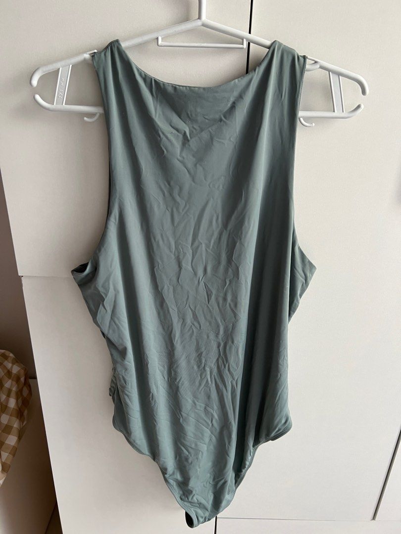 Shein blue green bodysuit (Category: Sleeveless) located in Bulacan. Submitted by lezzdeclutter (Listing ID 1357089344, Image 2). Description: Size Large Very cutesy ✨ Personal fave NO Flaws 💯 Rfs: decluttering since i’m now pregnant 📍Malolos, Bulacan .