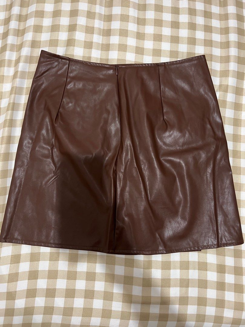 Shein Brown leather skirt (Category: Skirts) located in Bulacan. Submitted by lezzdeclutter (Listing ID 1357114142, Image 2). Description: Size Large Used once Personal fave ✨ NO Flaws 💯 Rfs: decluttering since i’m now pregnant 📍Malolos, Bulacan.