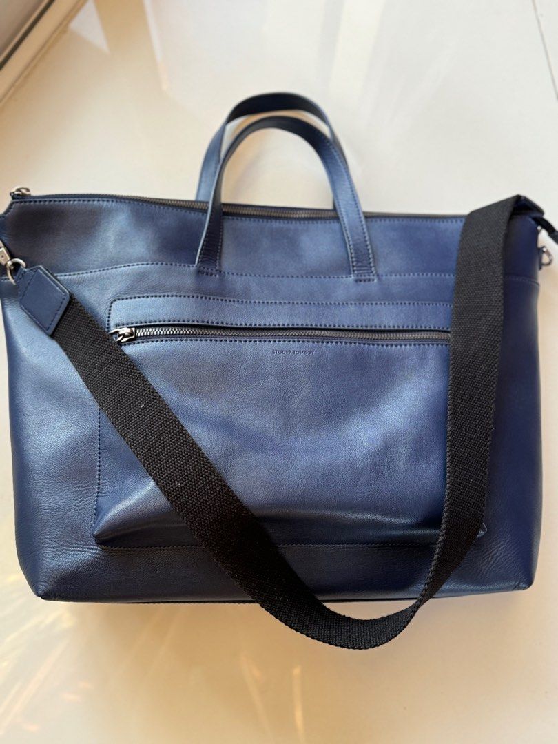 Studio Tomboy 2-way bag (free SF) (Category: Shoulder Bags) located in Makati City. Submitted by ada_finds (Listing ID 1357000714, Image 1). Description: Studio Tomboy pre loved ₱1,900 (free SF) size: 12x17.5 in color: dark blue & gun metal hardware, with medium sized-black strap style: 2-way bag (handbag, shoulder bag) design: soft leather, 1 zipper front pocket, zipper closure inside: 1 open pocket and 1 zipper pocket sign of usage: minimal scr