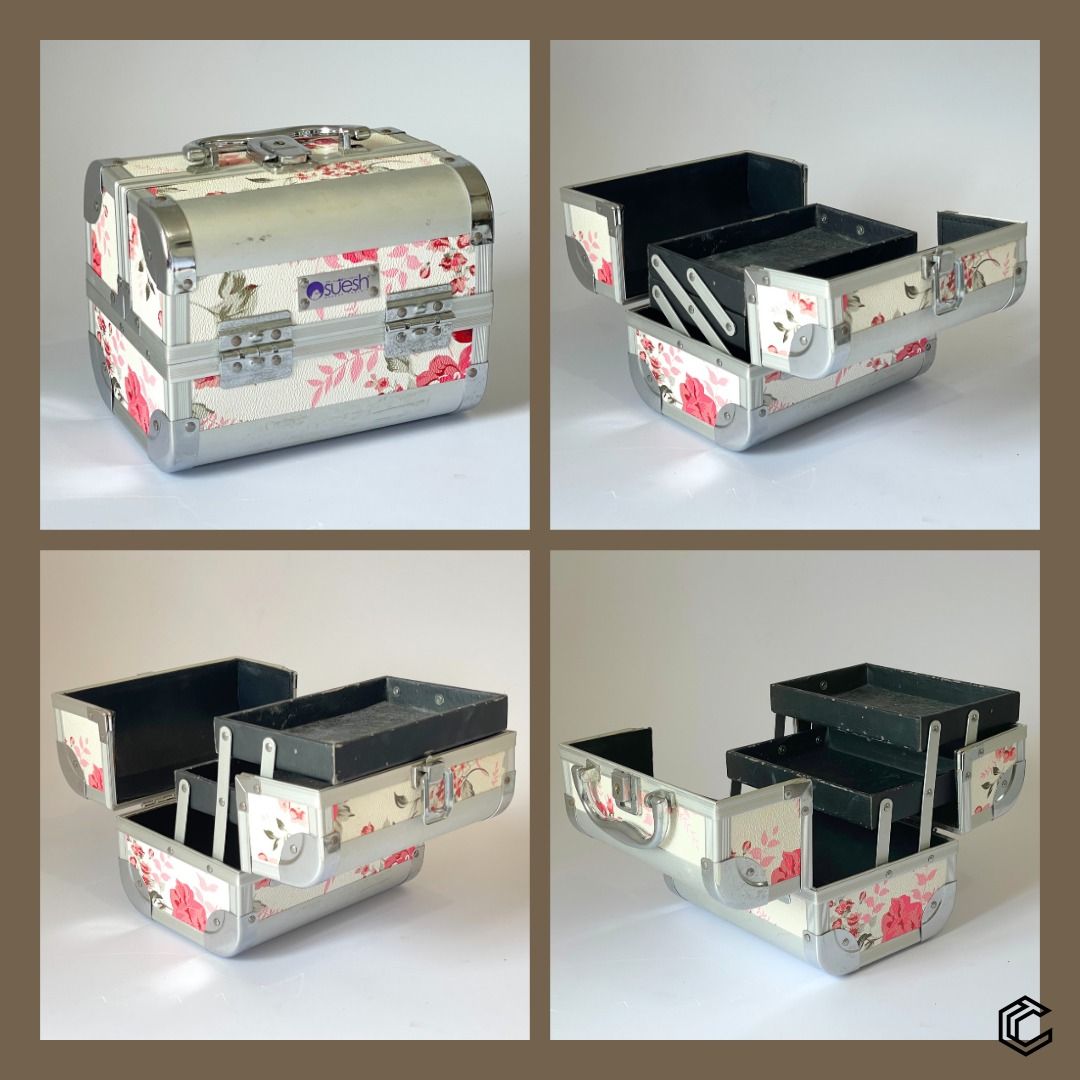 Suesh Floral Train Case – Multi-Layer Makeup & Storage Box (Category: Makeup) located in Bacoor. Submitted by box_of_randoms (Listing ID 1357120918, Image 2). Description: Specification: • Brand: Suesh • Type: Expandable Train Case • Color: White with floral pattern • Material: Sturdy aluminum frame with reinforced corners • Compartments: Multi-tiered, fold-out trays for better organization • Closure: Secure latch with handle for portability • Id