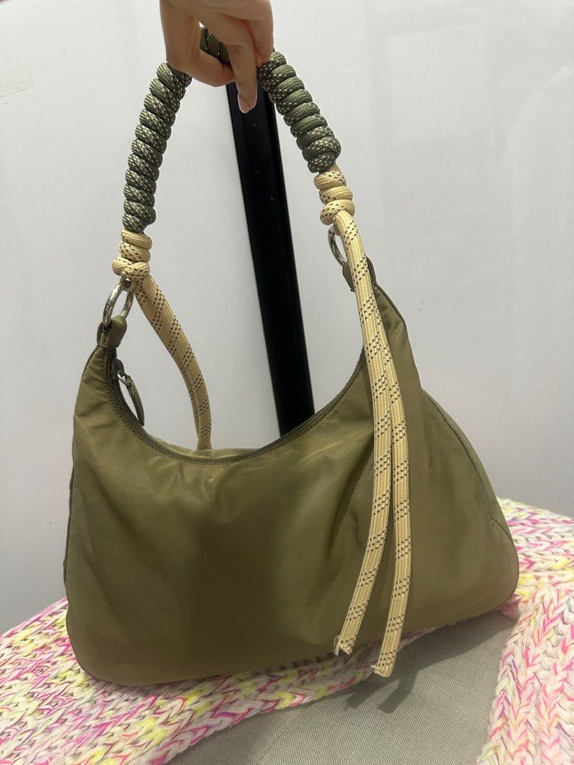 Authentic Prada kilikili bag (Category: Luxury Bags & Wallets) located in Paranaque City. Submitted by jomaaaalones (Listing ID 1357382211, Image 3). Description: selling this authentic prada kilikili bag changed the strap already from a polycarbonate plastic hardware strap to this cutesy rope style generic kilikili strap i bought in Michaels(us). You can change it to another strap as well of your preferences Bag is greenish with discoloarations 