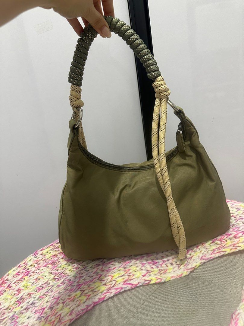 Authentic Prada kilikili bag (Category: Luxury Bags & Wallets) located in Paranaque City. Submitted by jomaaaalones (Listing ID 1357382211, Image 2). Description: selling this authentic prada kilikili bag changed the strap already from a polycarbonate plastic hardware strap to this cutesy rope style generic kilikili strap i bought in Michaels(us). You can change it to another strap as well of your preferences Bag is greenish with discoloarations 