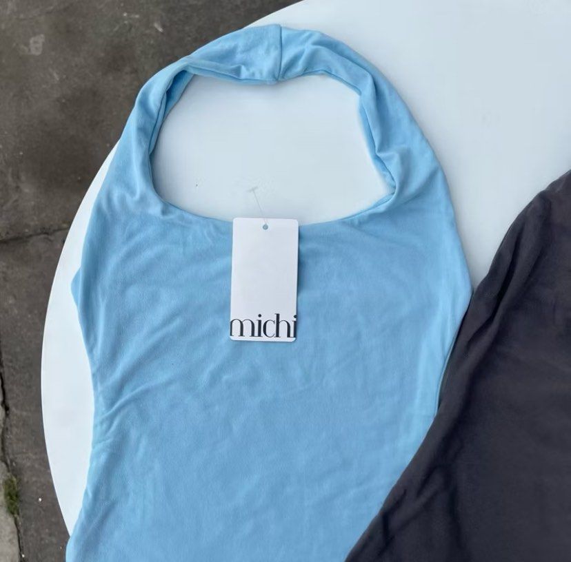 Michi Clio Halter Top in Powder Blue (Category: Sleeveless) located in Cavite. Submitted by declutter_andie09 (Listing ID 1357291785, Image 1). Description: Michi Clip Halter Top in Powder Blue Size: S-M Double Lining Brand New, never worn except to fit cute top very flattering RFS: decluttering og price: 79 selling for: 65 location : Quezon City shipping via lalamove payment via gcash sf will be shouldered by buyer.