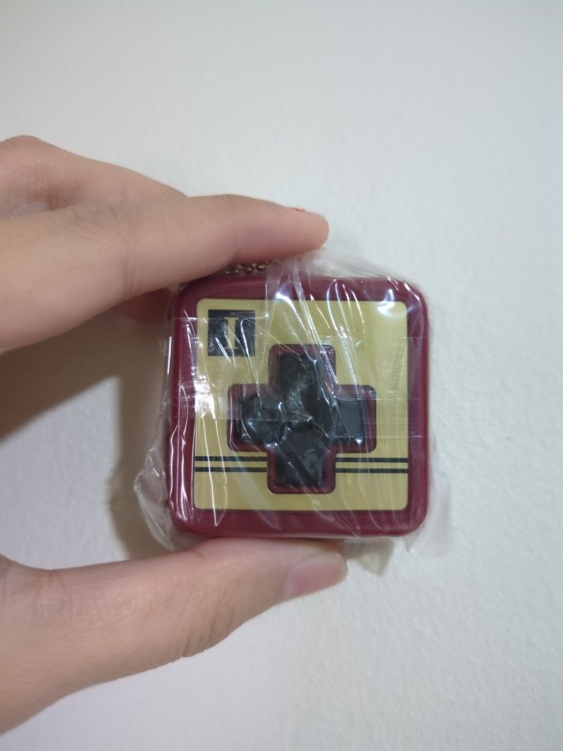 Nintendo Famicom Gashapon Controller Keychain Collection (Category: Designer & Blind Box Toys) located in Singapore. Submitted by uwu_bakchoy (Listing ID 1357295534, Image 1). Description: Brand New.