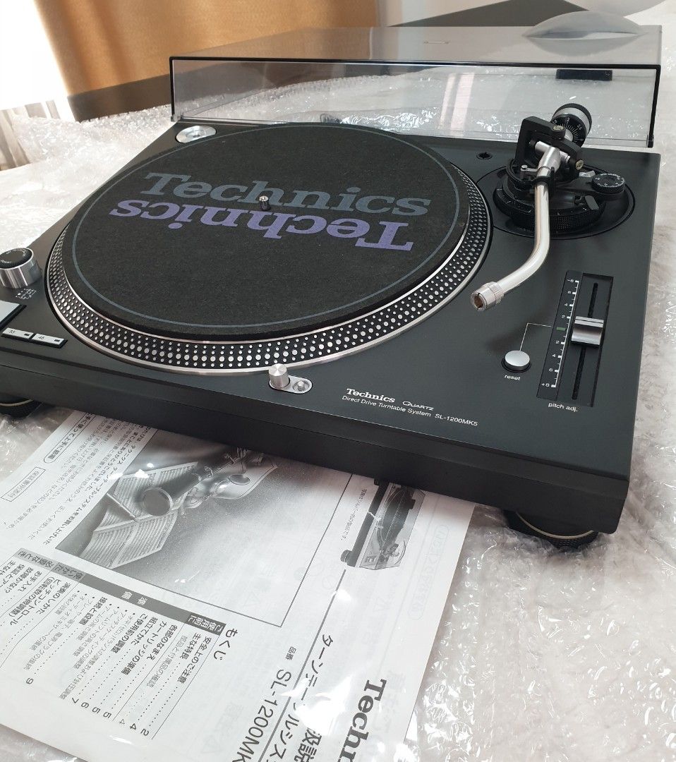 Technics SL-1200MK5 Direct Drive Turntable (Category: Soundbars, Speakers & Amplifiers) located in Manila. Submitted by racz03 (Listing ID 1357285590, Image 2). Description: New Arrival...Fresh From Japan... Technics SL-1200MK5 Direct Drive Turntable Black Nearmint Condition.. Good As New And Presentable, with User's Guide.. with Slipmat, Rubber Mat, 45 Rpm Adapter, and Dustcover. Operating Power Voltage 100V.