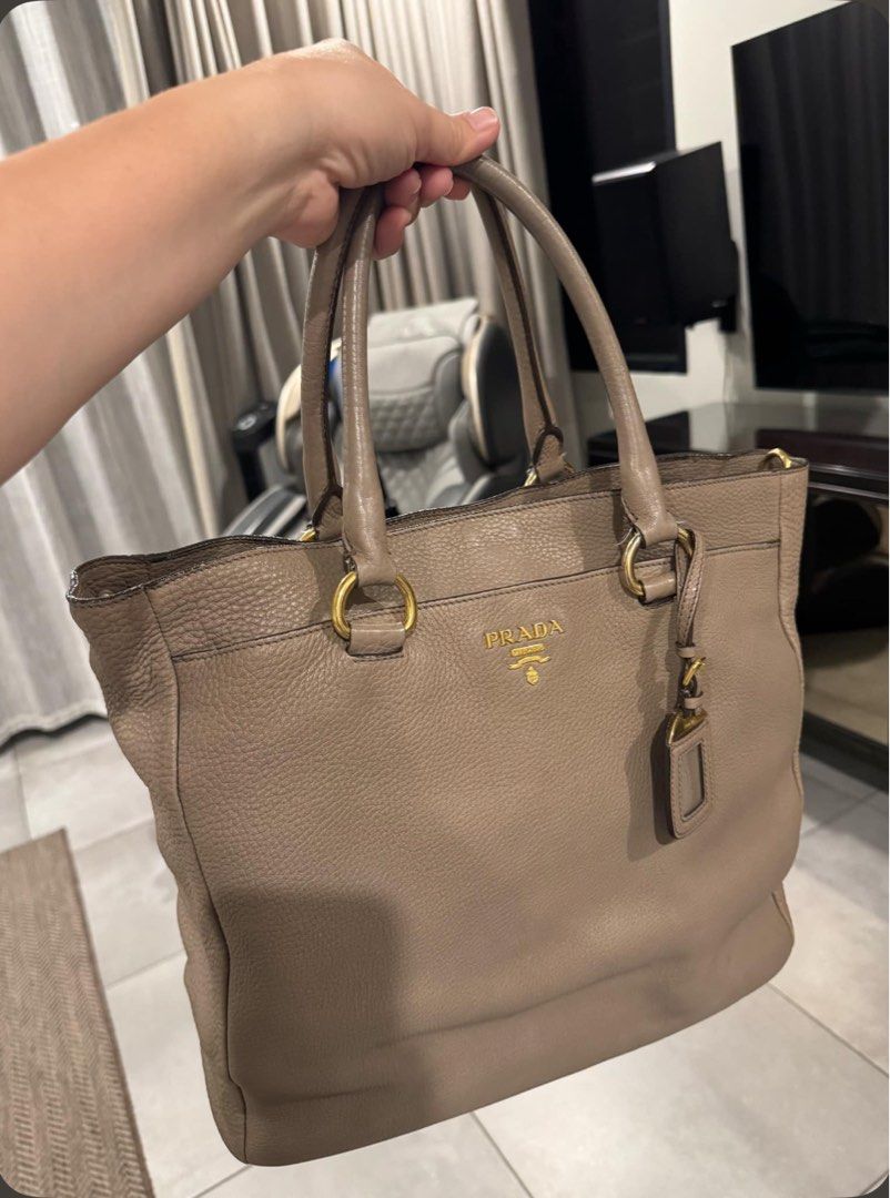 Auth Prada Vitello Daino Argilla (Category: Luxury Bags & Wallets) located in Antipolo. Submitted by authenticstuff4you (Listing ID 1361378407, Image 3). Description: Selling this lightly used Authentic Prada Vitello Daino Shopping Tote Bag in Argilla. I’m the first owner, bought in Hong Kong for around 100k. Exterior leather is still clean with just light wear. Interior is also clean and well maintained. Light wear at the bottom edges but nothin